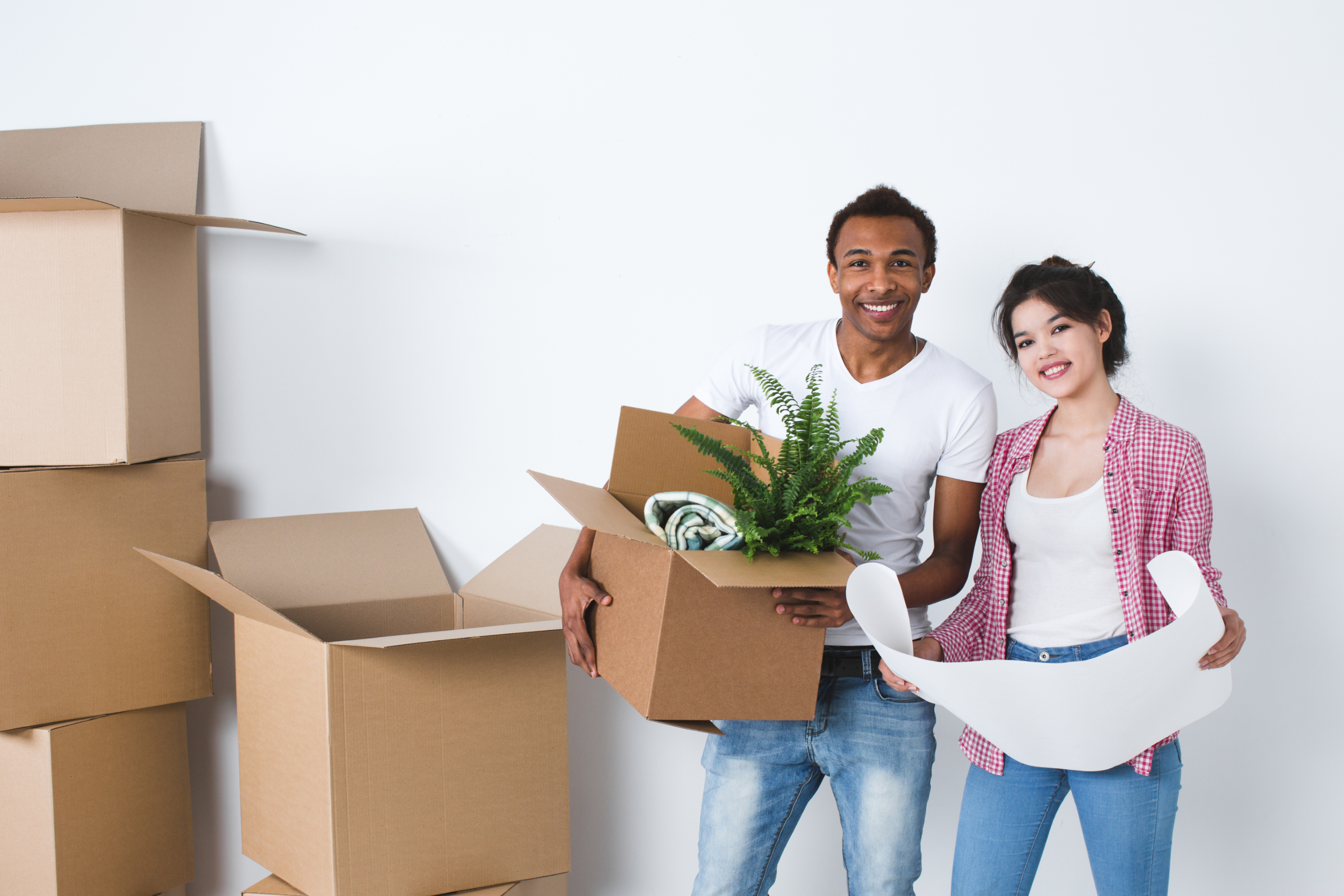 A young couple moving into a new home A young couple moving into a new home